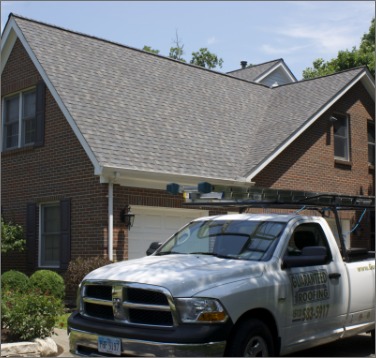A photo with a car outside the house waiting for Gutter Repair